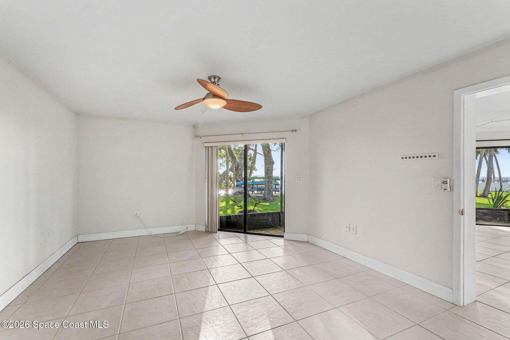 100 Canebreakers Drive, Unit 108 Cocoa, FL 32927 - Photo 7 of 17 a view of an empty room with a window