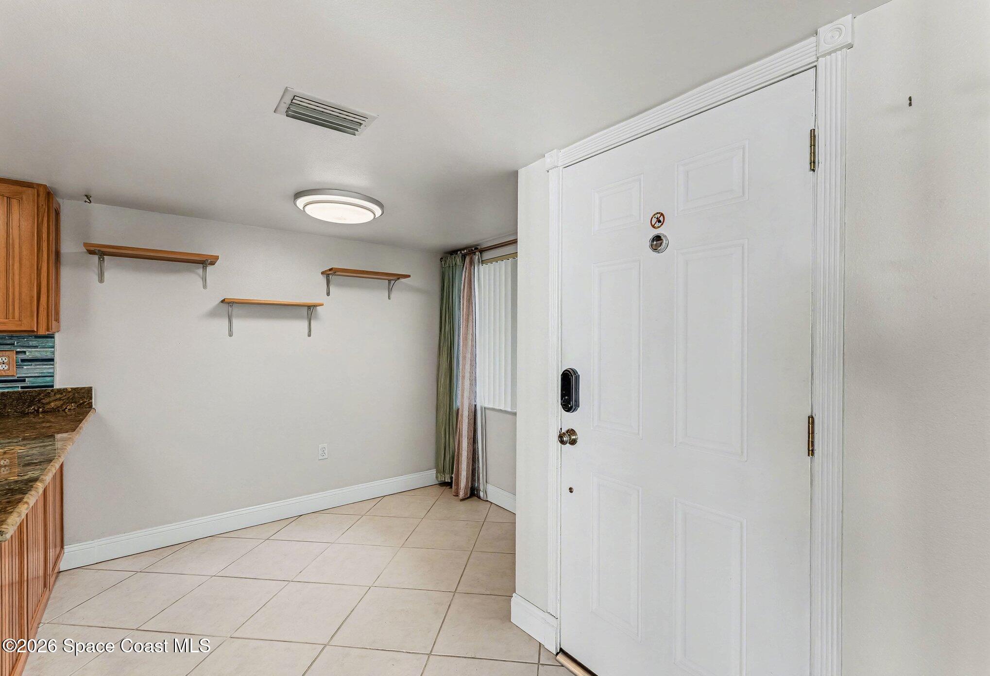 100 Canebreakers Drive, Unit 108 Cocoa, FL 32927 - Photo 9 of 17 a view of an empty room