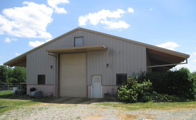 1933 C Chicken Road Lebanon, TN 37090 - Photo 1 of 10 Front View of Large Pre-engineered Barn with stalls down each side of 84' length of barn