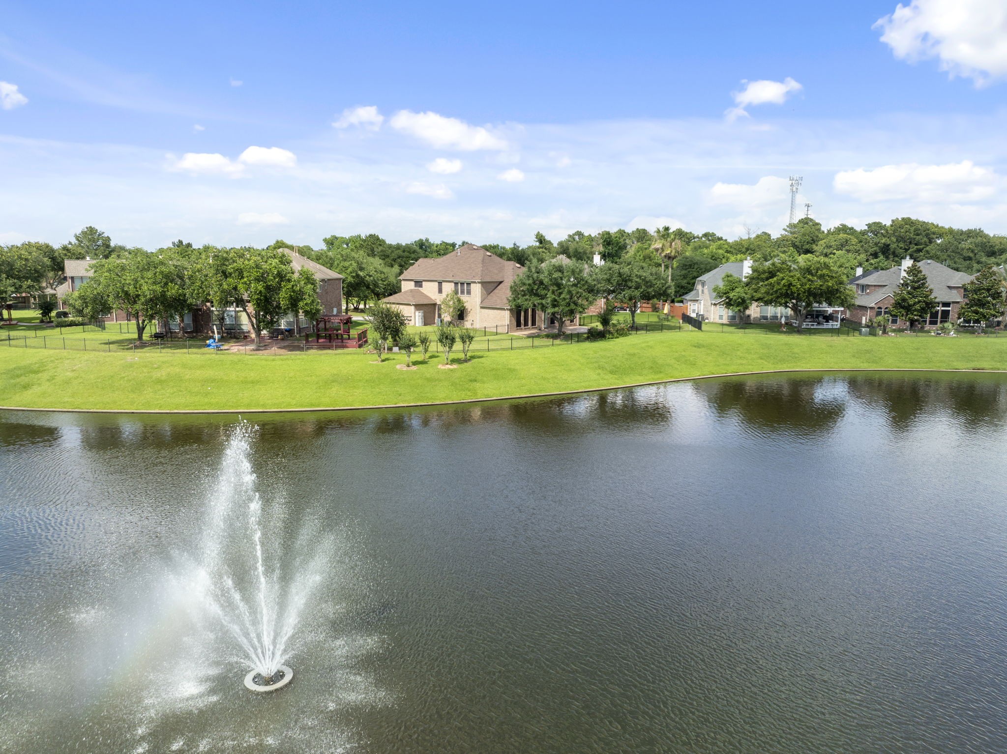 2907 Stemwood Drive Spring, TX 77388 - Photo 28 of 33 Stunning aerial waterfront views highlight the home’s expansive lot, peaceful lake setting, and scenic fountain backdrop—offering a private retreat with beautiful natural surroundings.