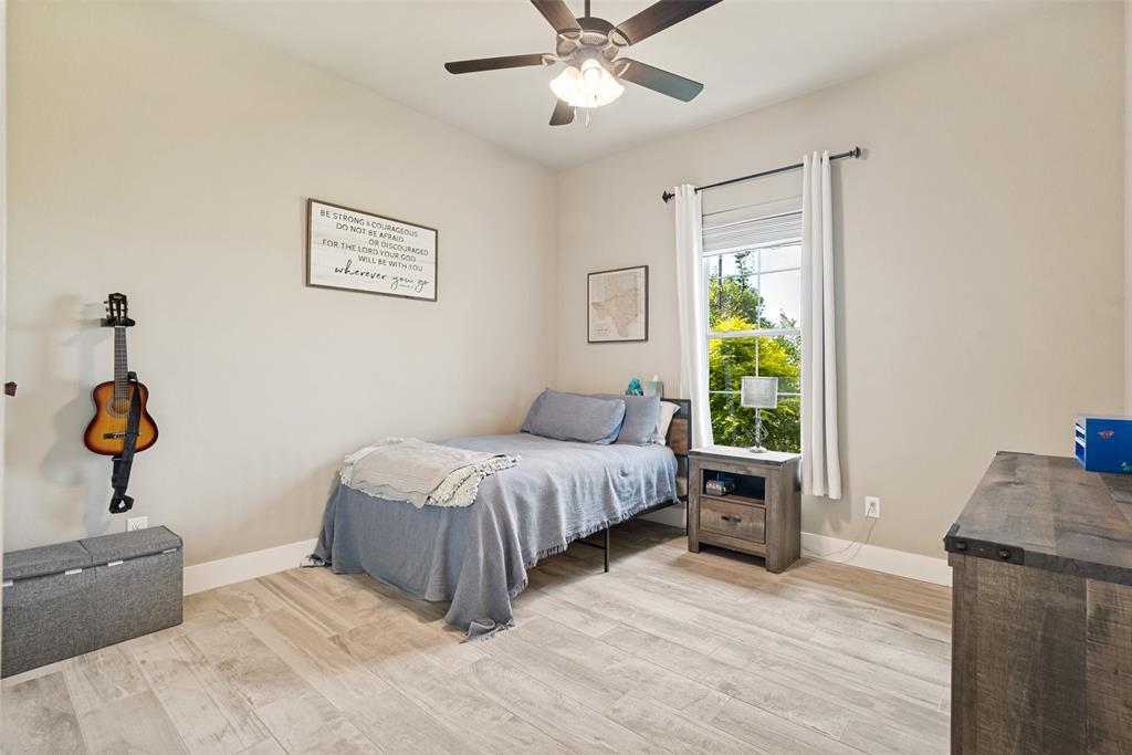 6913 Veal Station Road Weatherford, TX 76085 - Photo 20 of 31 Room featuring light-toned walls and wood-finish flooring
