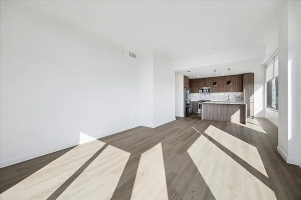 a bedroom with a bed and a lamp