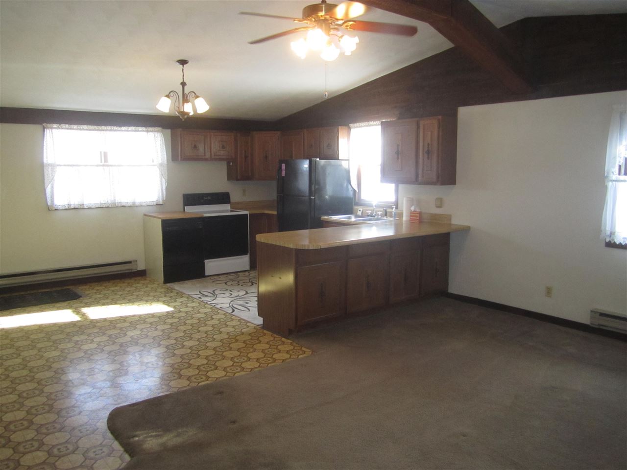 3767 Spring Center Road Garden Prairie, IL 61038 - Photo 4 of 17 a kitchen with stainless steel appliances granite countertop a sink a stove top oven a counter space and cabinets