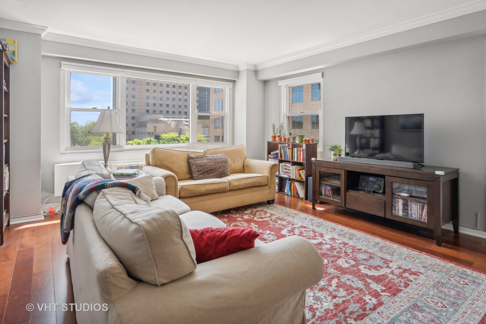 2909 North Sheridan Road, Unit 609 Chicago, IL 60657 - Photo 2 of 11 a living room with furniture and a flat screen tv