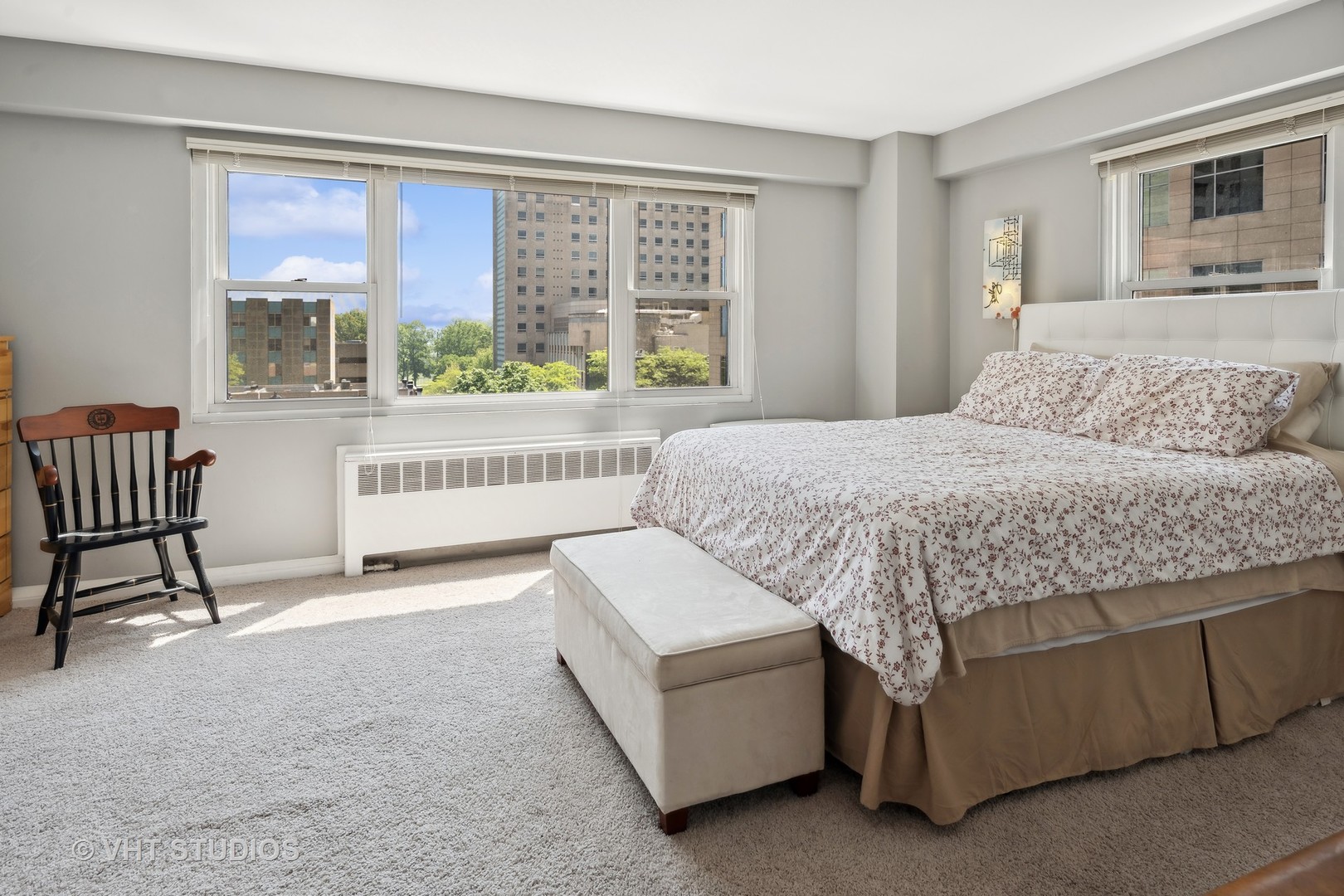 2909 North Sheridan Road, Unit 609 Chicago, IL 60657 - Photo 6 of 11 a living room with a bed furniture and a large window