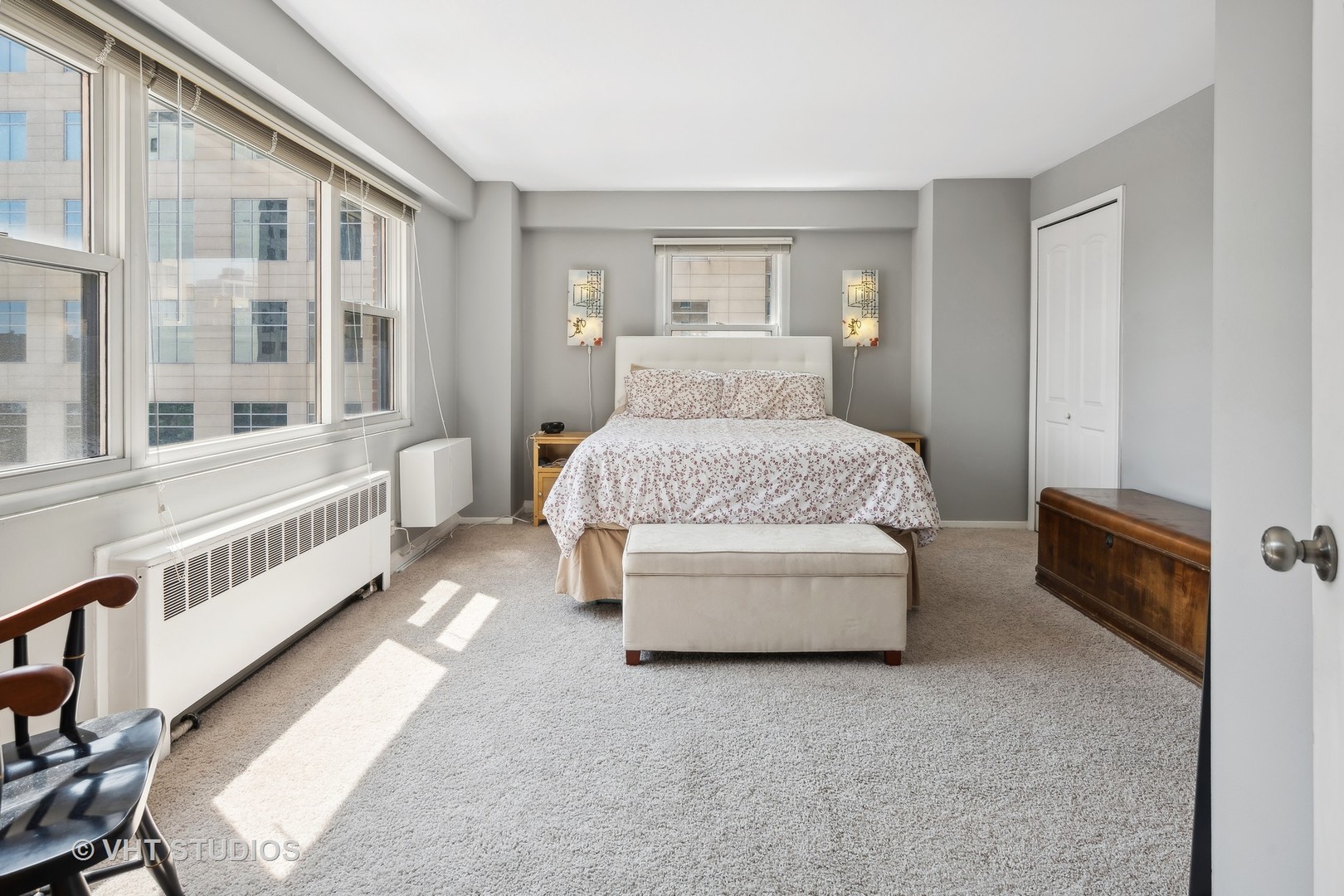 2909 North Sheridan Road, Unit 609 Chicago, IL 60657 - Photo 7 of 11 a room with a bed and a night stand