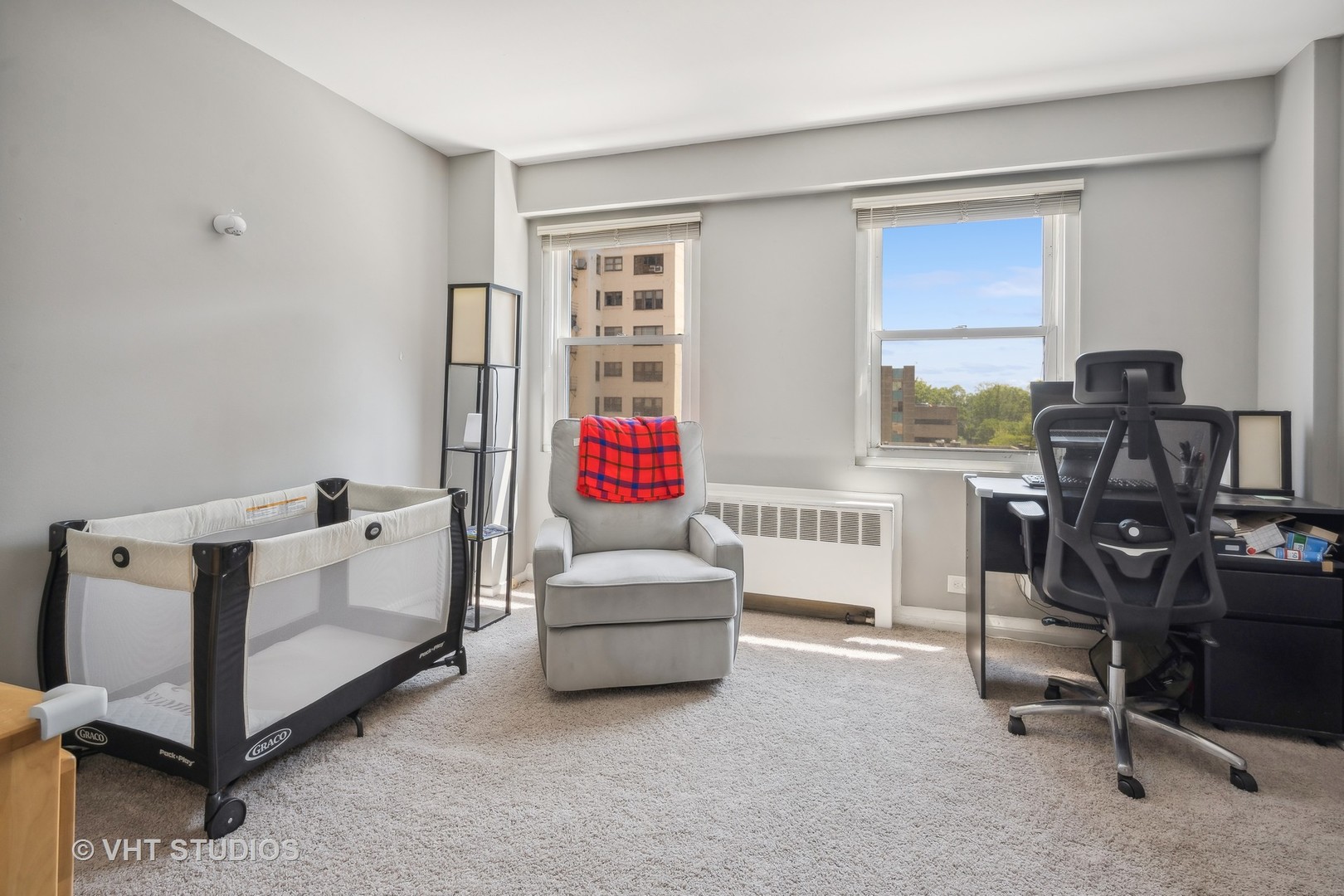 2909 North Sheridan Road, Unit 609 Chicago, IL 60657 - Photo 9 of 11 a living room with furniture and a window