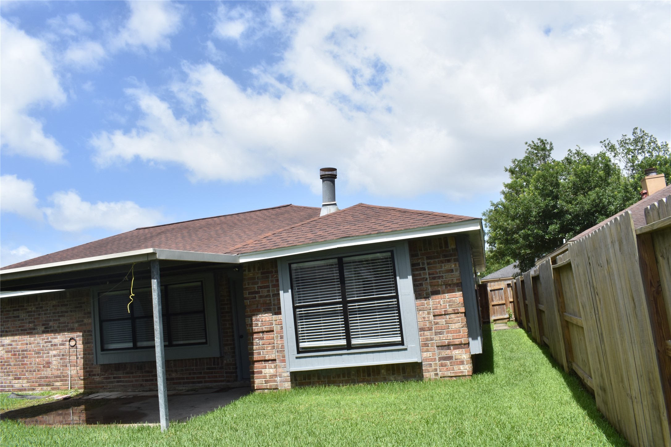 1347 Somercotes Lane Channelview, TX 77530 - Photo 28 of 30 a front view of a house with a garden