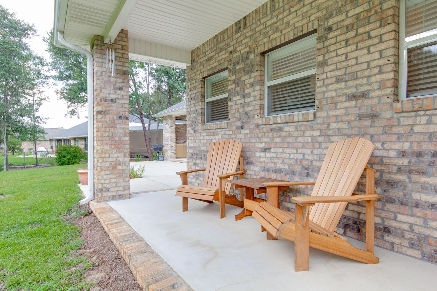 2573 Cove Road Navarre, FL 32566 - Photo 24 of 28 a view of backyard with outdoor seating