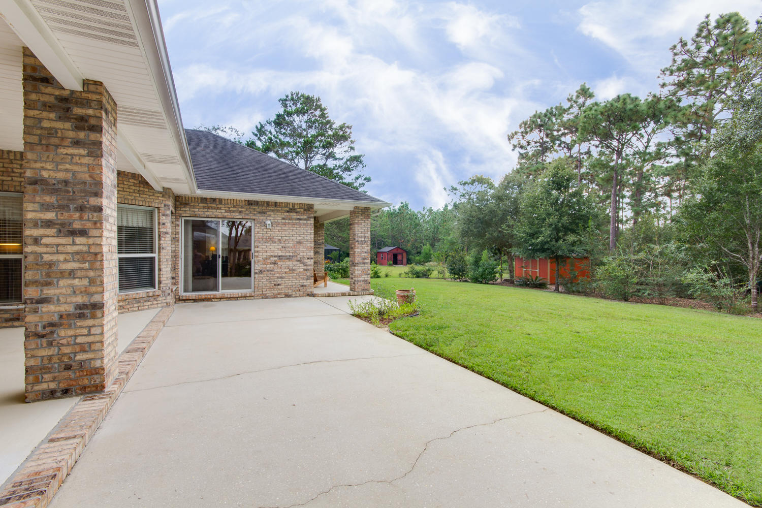 2573 Cove Road Navarre, FL 32566 - Photo 25 of 28 a front view of house with yard and green space