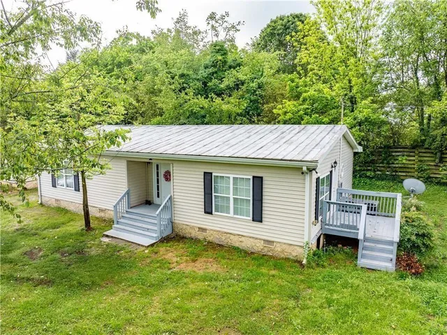 a backyard of a house with seating space