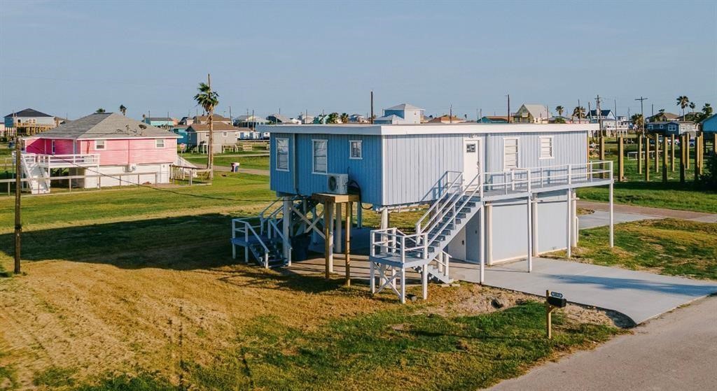 1019 Treaty Drive Surfside Beach, TX 77541 - Photo 1 of 43 a view of a house with backyard