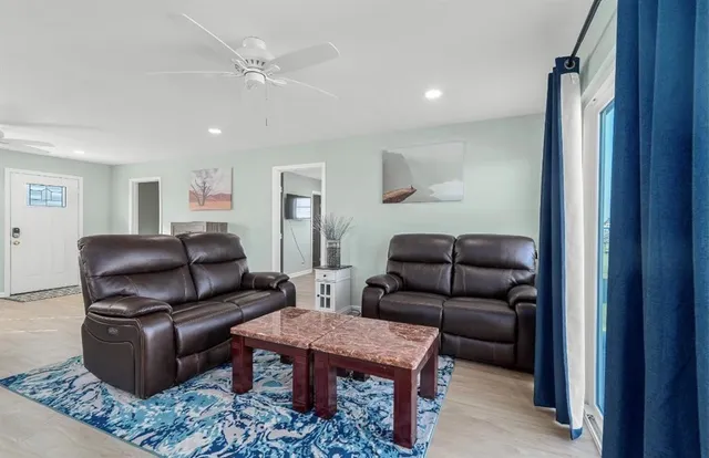 a living room with furniture and a rug