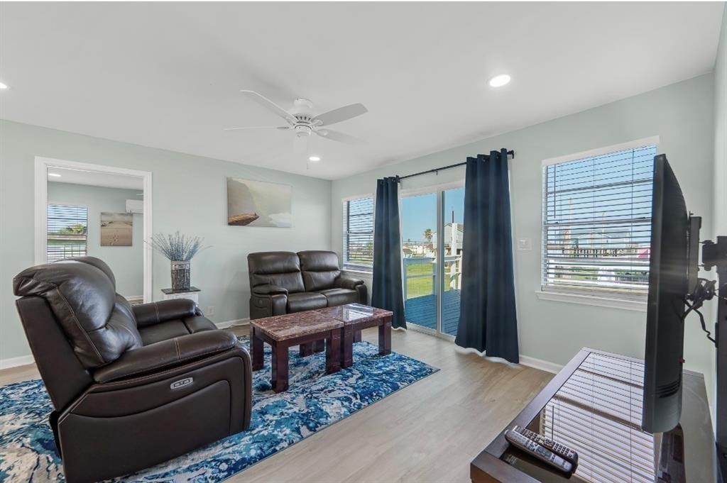 1019 Treaty Drive Surfside Beach, TX 77541 - Photo 12 of 43 a living room with furniture and wooden floor