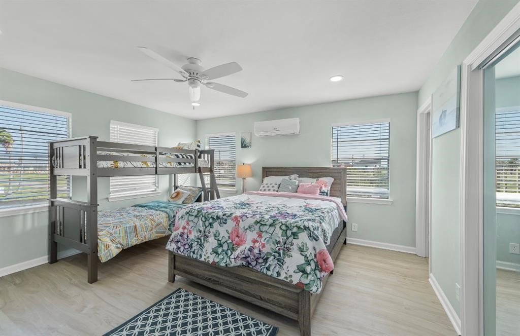 1019 Treaty Drive Surfside Beach, TX 77541 - Photo 13 of 43 a bedroom with a bed and a window