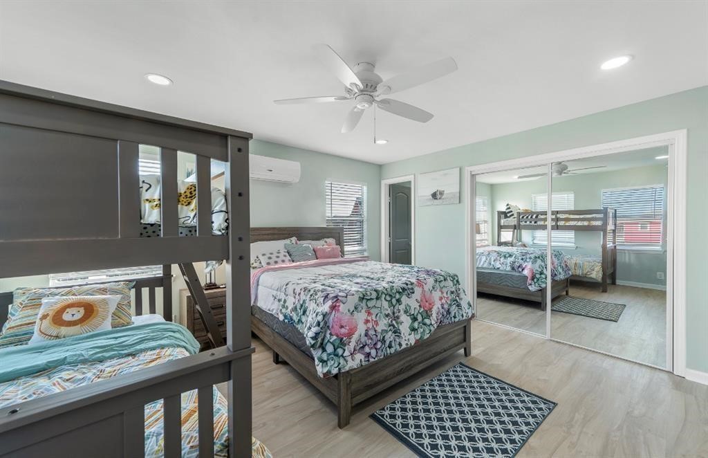 1019 Treaty Drive Surfside Beach, TX 77541 - Photo 14 of 43 a bedroom with a bed and a window