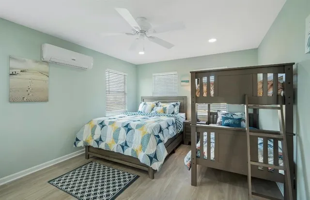 a bedroom with a bed and window