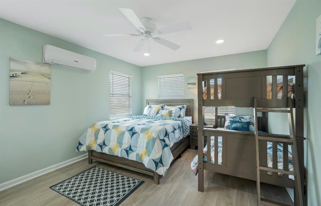 1019 Treaty Drive Surfside Beach, TX 77541 - Photo 20 of 43 a bedroom with a bed and window