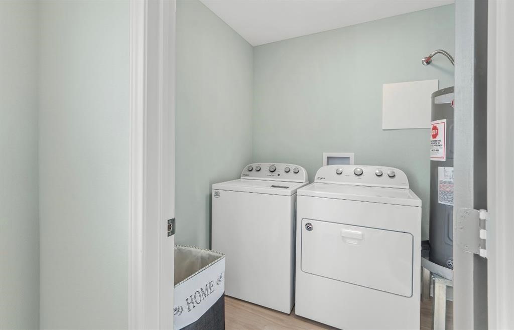 1019 Treaty Drive Surfside Beach, TX 77541 - Photo 24 of 43 a utility room with dryer and washer