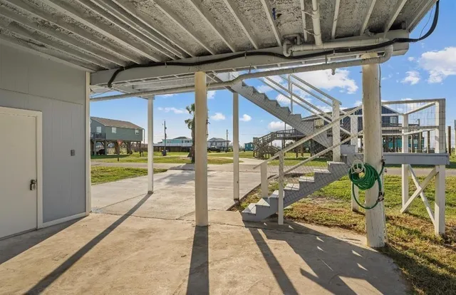 a view of a garage with wooden floor