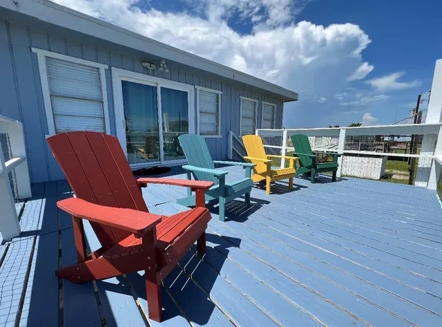a view of a lounge chairs in the patio