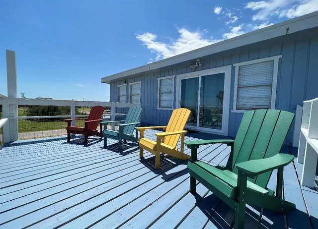 a view of a chairs in wooden deck