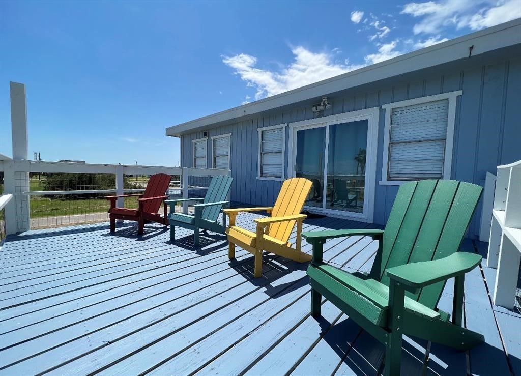 1019 Treaty Drive Surfside Beach, TX 77541 - Photo 35 of 43 a view of a chairs in wooden deck