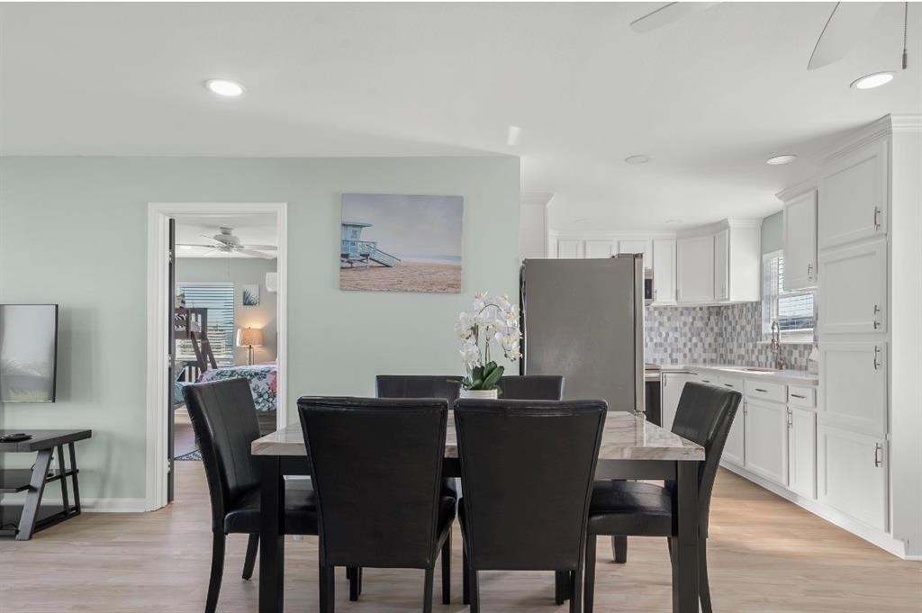 1019 Treaty Drive Surfside Beach, TX 77541 - Photo 7 of 43 a dining room with furniture and window