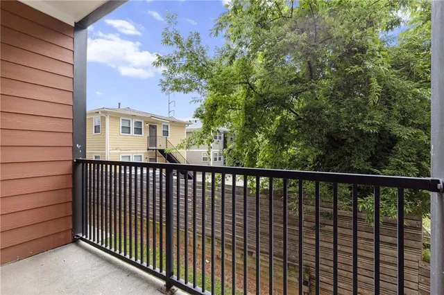 a view of a balcony with a pot