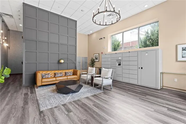 a living room with furniture a table and chairs