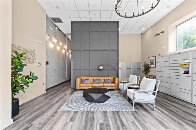 a living room with furniture and a potted plant