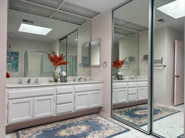 a bedroom with double bed and a window