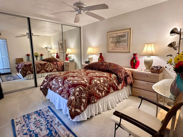 a bathroom with a double vanity sink mirror and shower