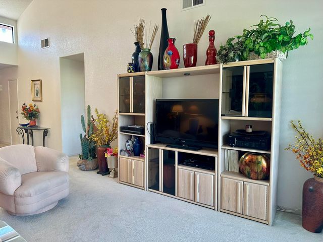 a kitchen with stainless steel appliances granite countertop a sink and a stove