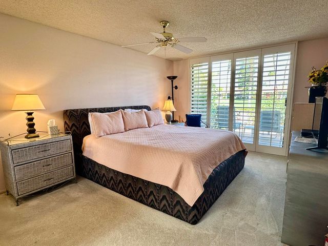 a spacious bathroom with a shower sink and mirror