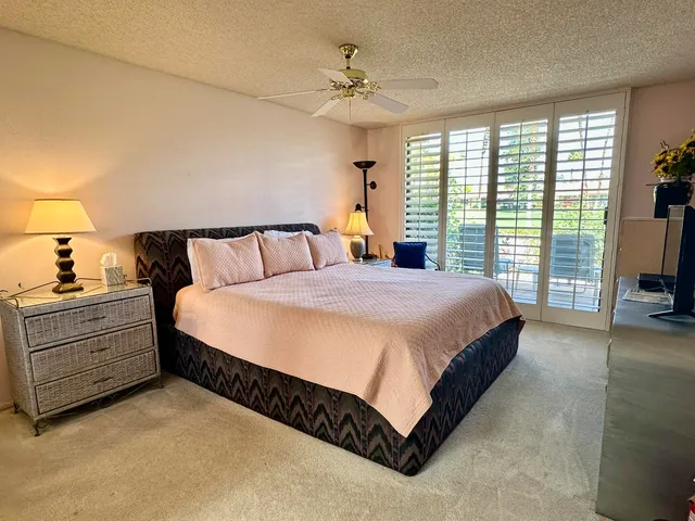 a spacious bathroom with a shower sink and mirror