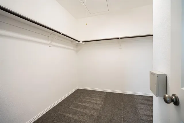 a view of an empty walk in closet