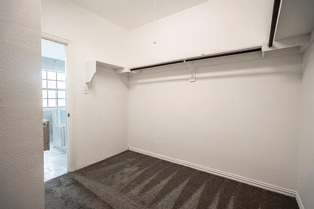 a view of a room with wooden floor and cabinet