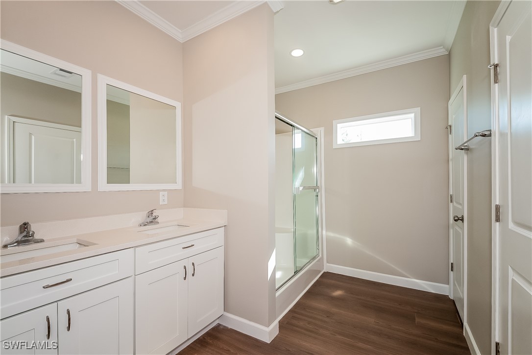 217 Santurce Avenue North Port, FL 34287 - Photo 12 of 16 a spacious bathroom with a double vanity sink a mirror and a shower