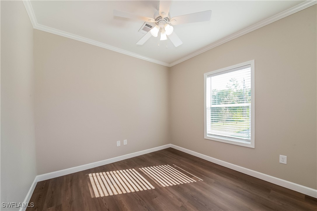 217 Santurce Avenue North Port, FL 34287 - Photo 13 of 16 wooden floor in an empty room with a window
