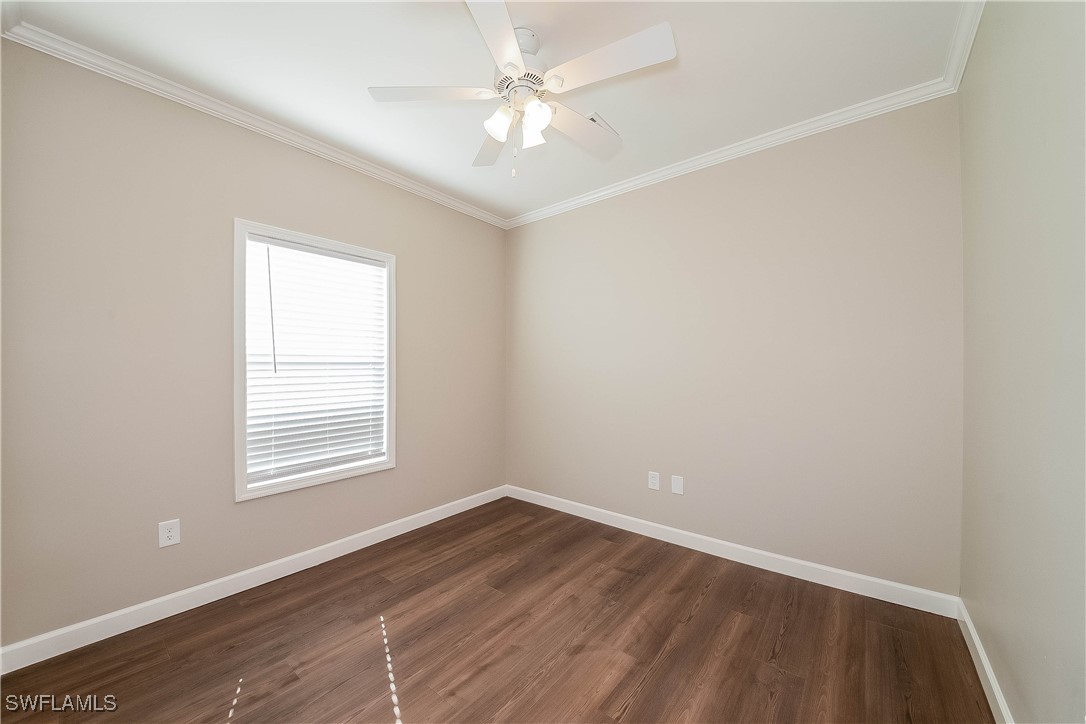 217 Santurce Avenue North Port, FL 34287 - Photo 14 of 16 an empty room with wooden floor and windows