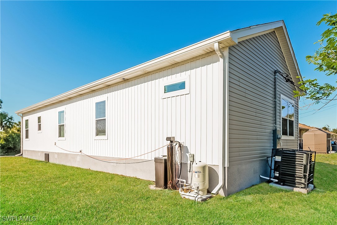 217 Santurce Avenue North Port, FL 34287 - Photo 16 of 16 a front view of a house with a garden