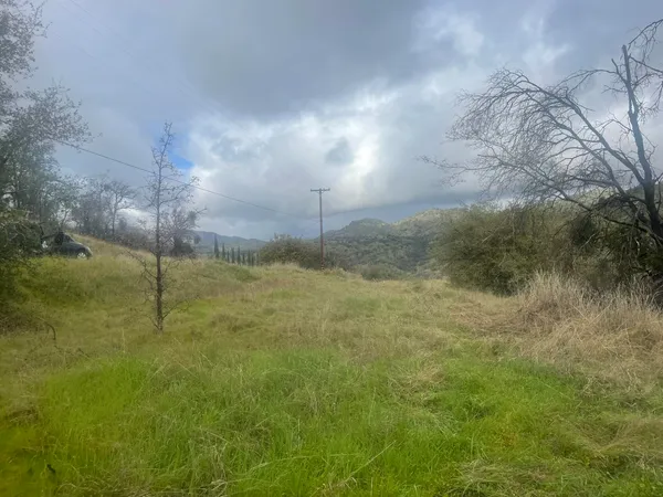 a view of a lake with a yard