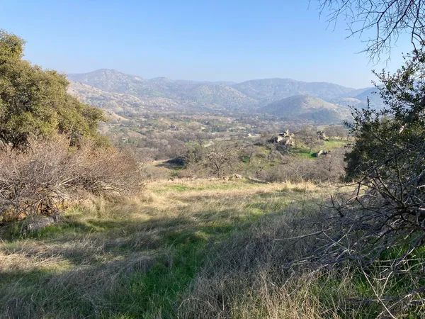 a view of a town with mountains in the background