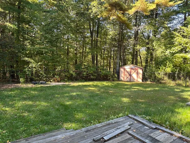 a backyard of a house with lots of green space