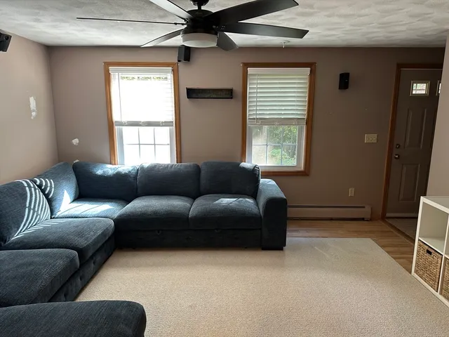 a living room with furniture and a window