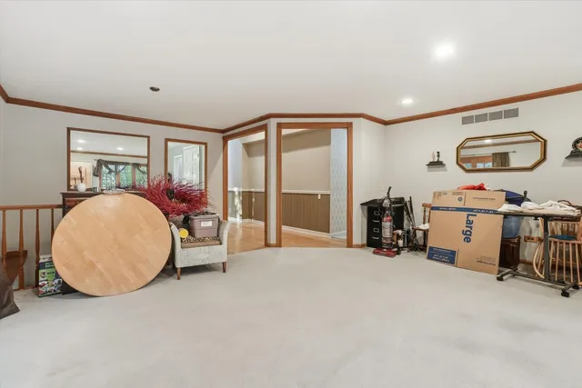 a view of a livingroom with workspace and a window