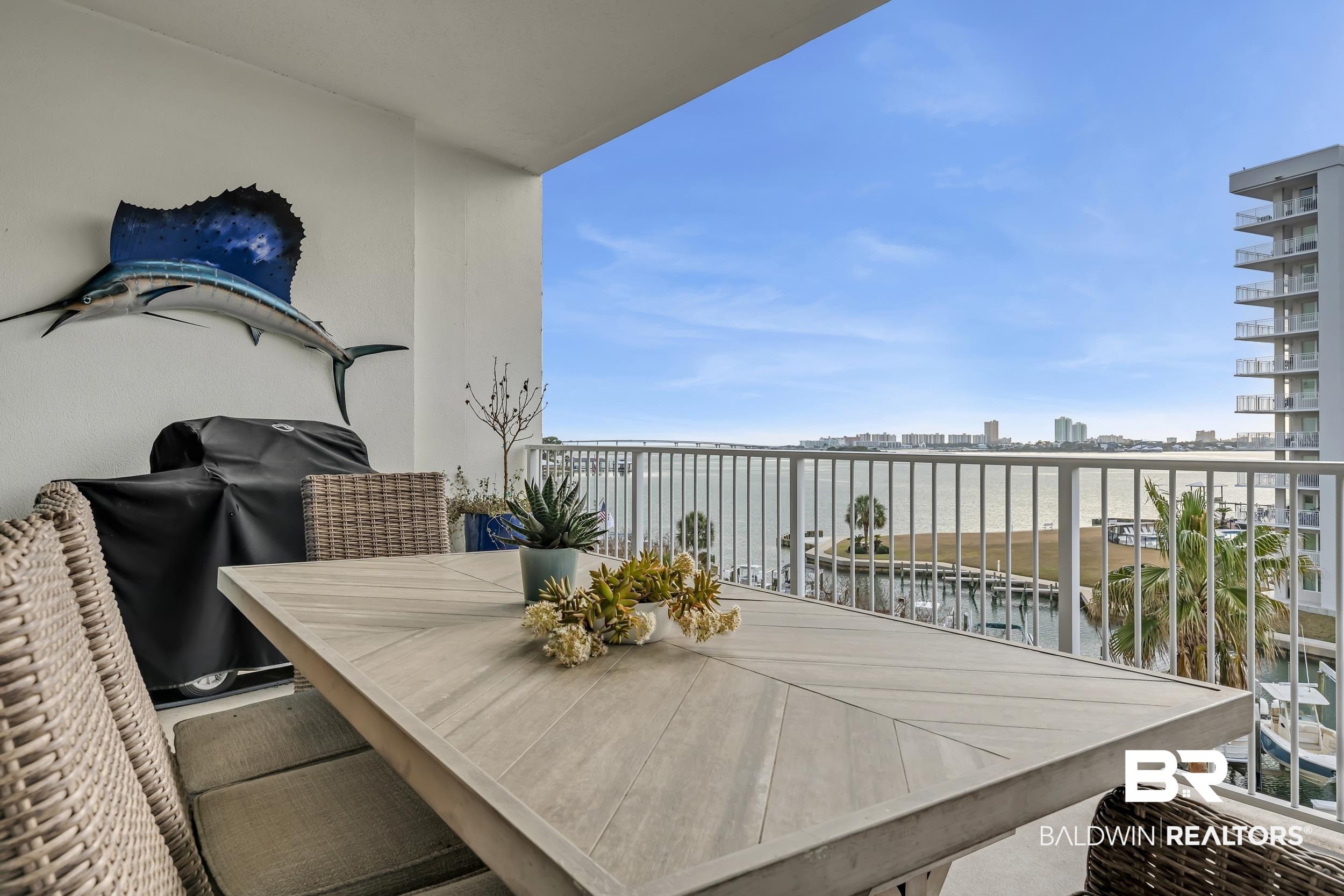 28250 Canal Road, Unit 307 Orange Beach, AL 36561 - Photo 31 of 56 Balcony featuring outdoor dining area, a view of city, and area for grilling