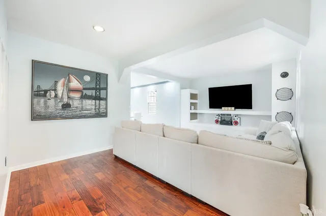 a kitchen with a stove a sink and a refrigerator