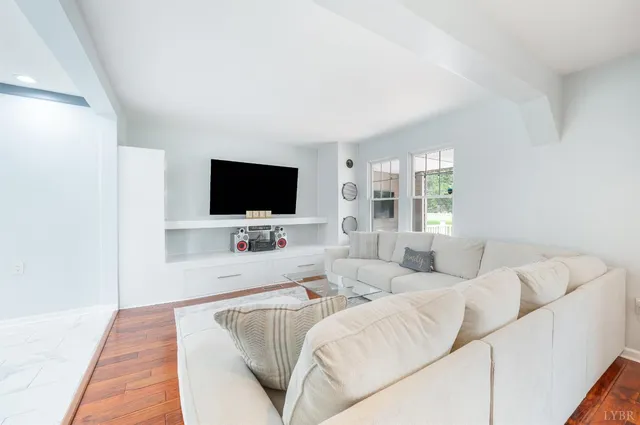 a kitchen with a refrigerator and a stove top oven